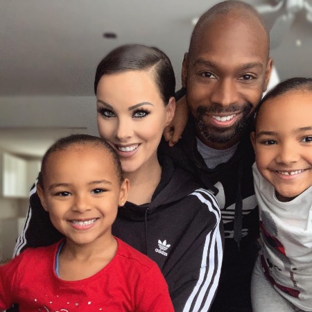 Heather Austrie with her husband and two daughters.
